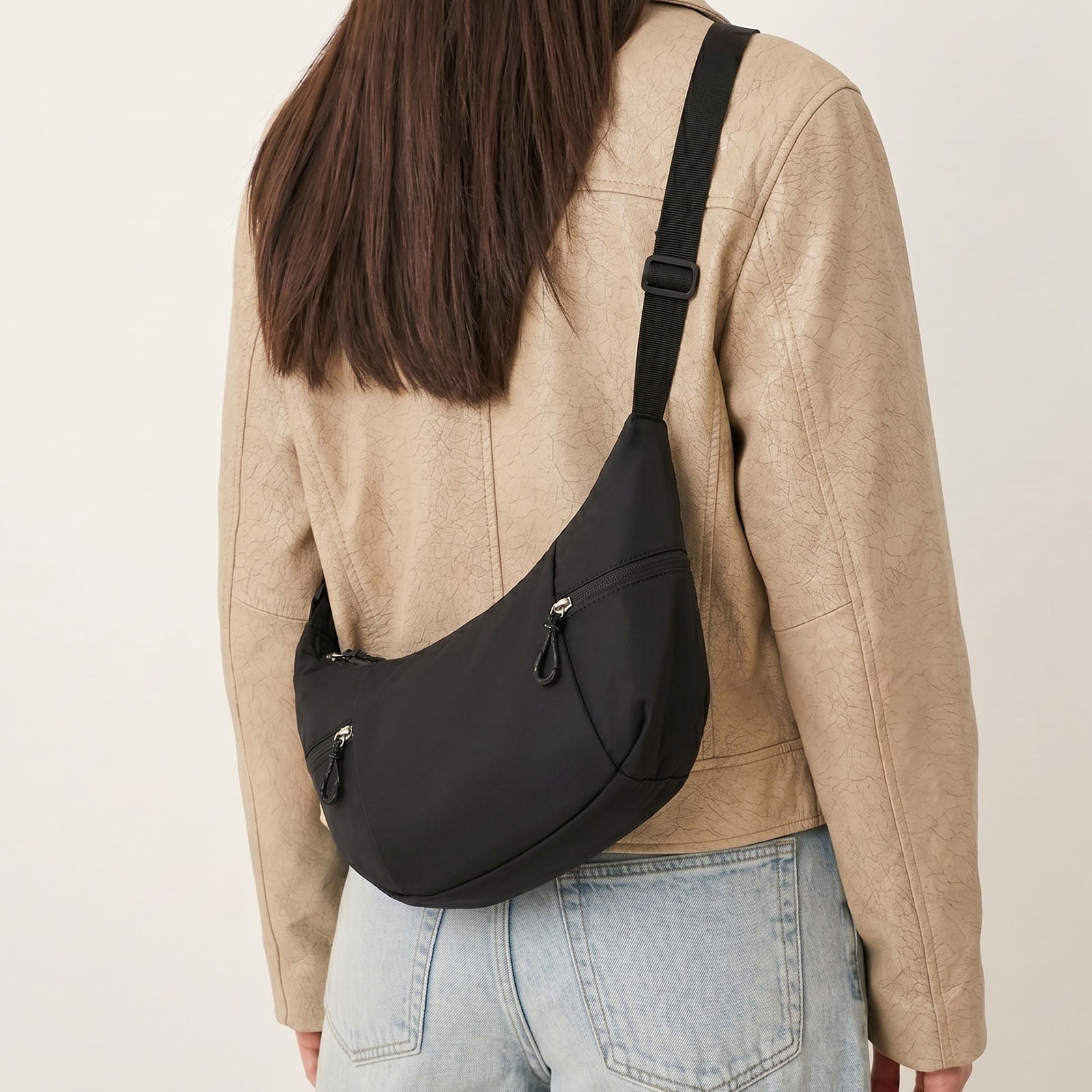 Elegant Woman Wearing Black Nylon Shoulder Bag with Dual Pockets