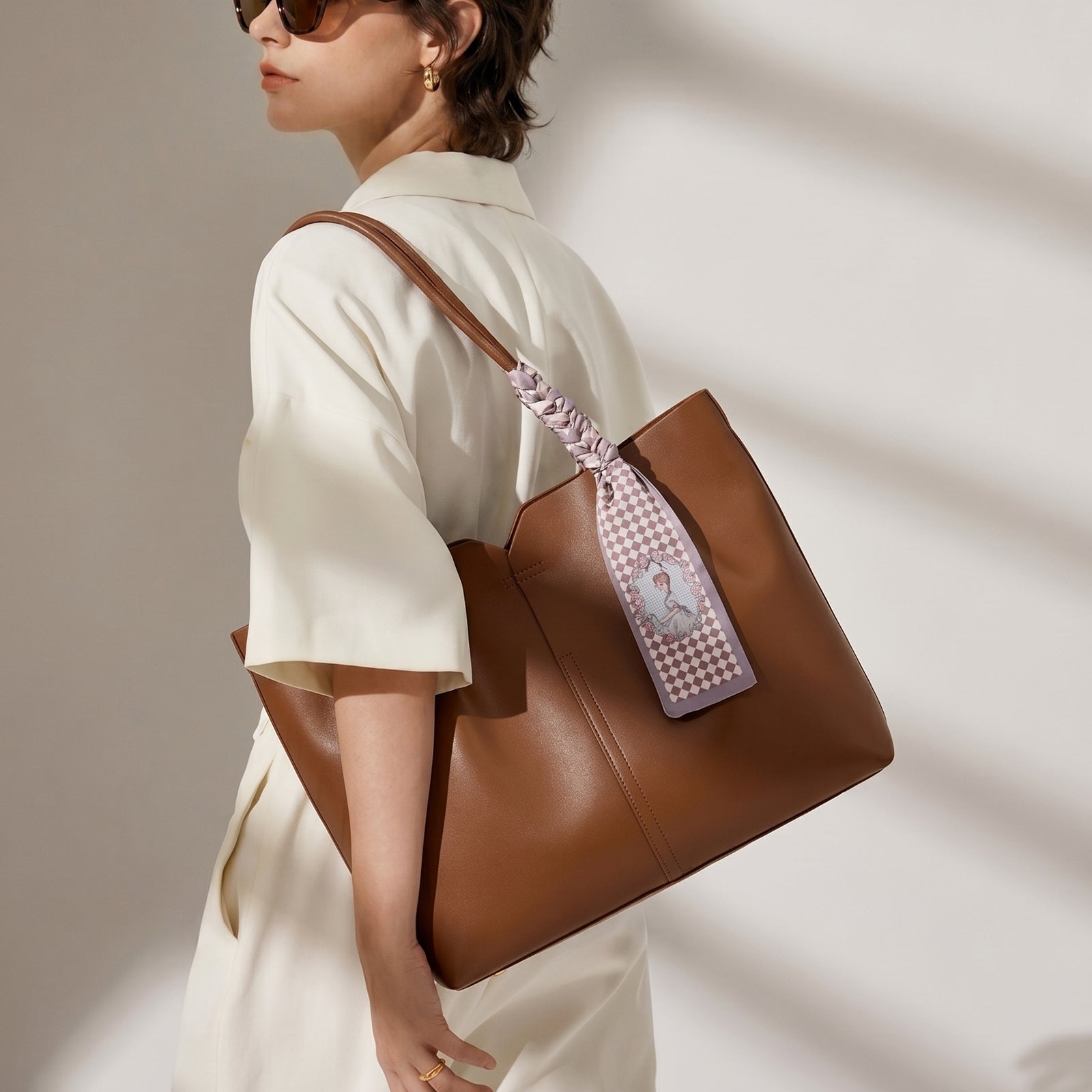 Interior Scene Lady Carrying Brown Leather Tote Bag, Side View