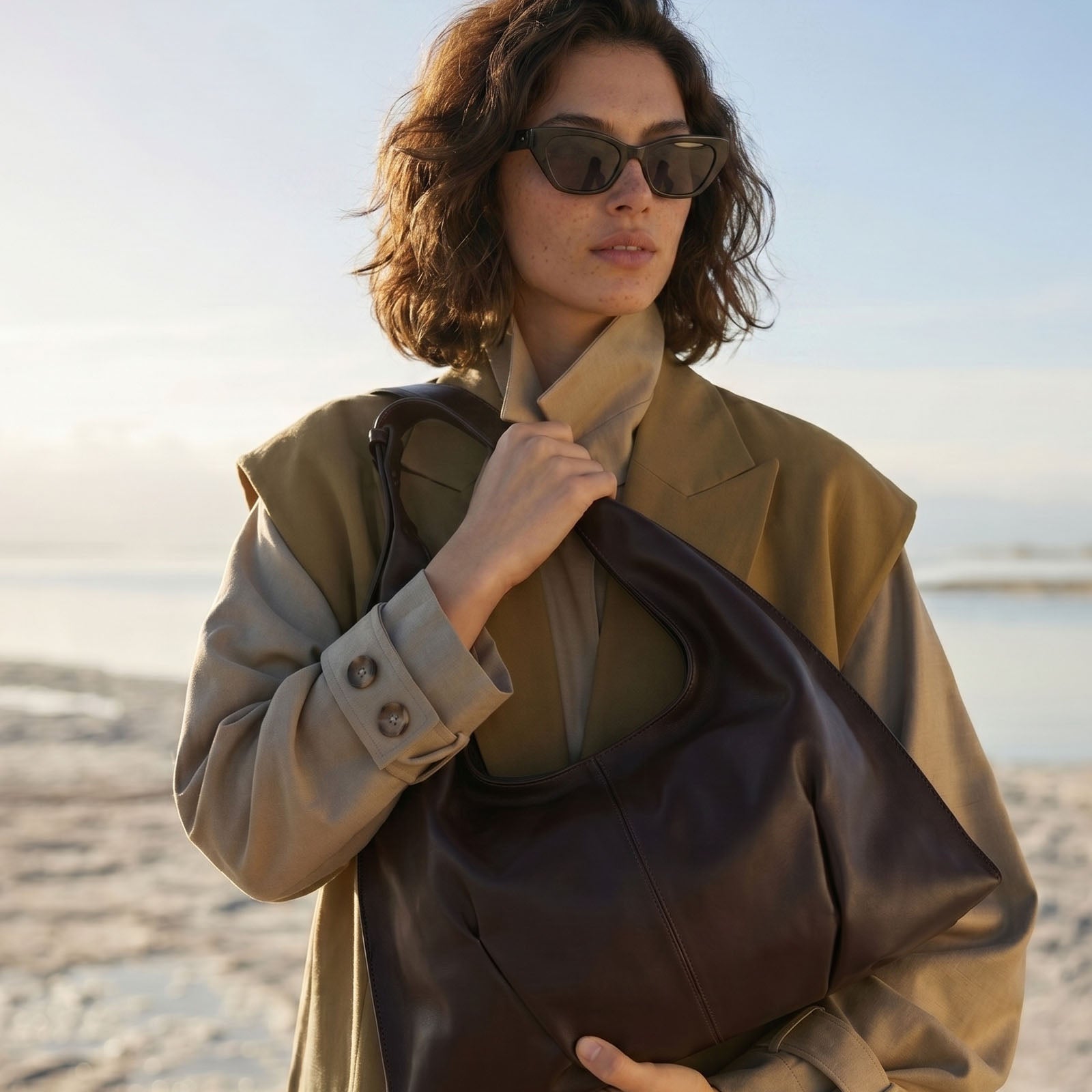 Fashional Woman Wearing Brown Quilted Shoulder Bag in Outdoor